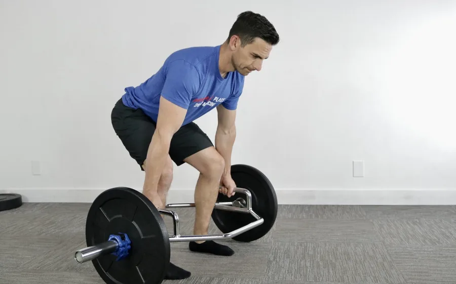 Man performing a trap bar deadlift