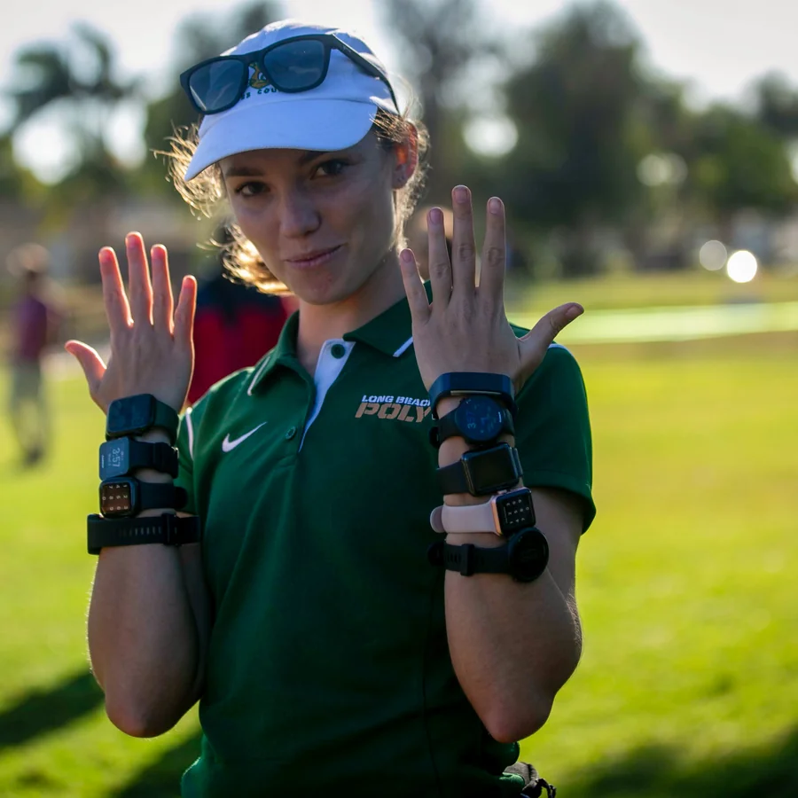 Mandy Wainfan coaching cross country at a track meet