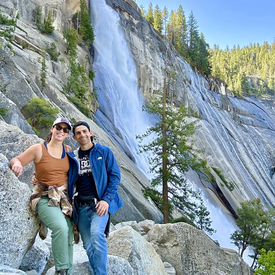 Sebastian Gonzales hiking near a waterfall in Yosemite